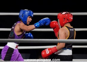 Nikhat Zareen of NE Rhinos throws a right at her opponent during the Big Bout Indian Boxing League 2019.jpg