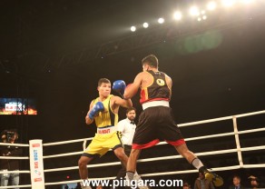 Odisha Warriors' Jakhongir Rakhmonov (yellow) in action against Bengaluru Brawlers' Dinesh Dagar during the Big Bout Indian Boxing League in Delhi's Indira Gandhi Indoor Stadium today (1).JPG