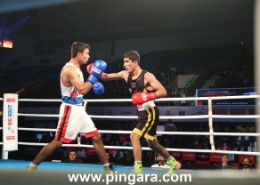 Punjab Panthers' A. Khalakov (R) in action against Gujarat Giants' Chirag during the finals of the Big Bout Indian Boxing League.JPG